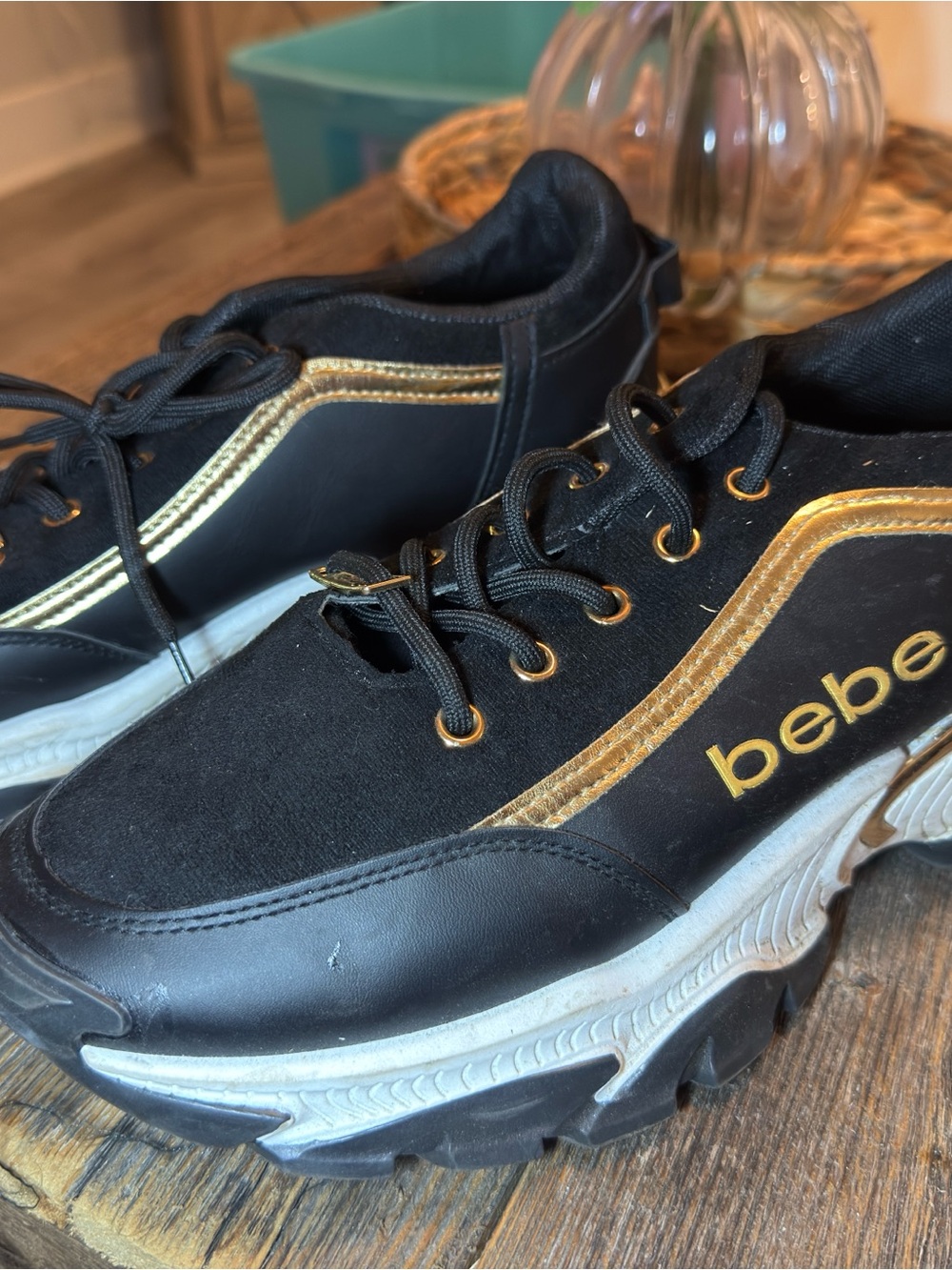 bebe Black Sneakers with Gold Trim and Logo